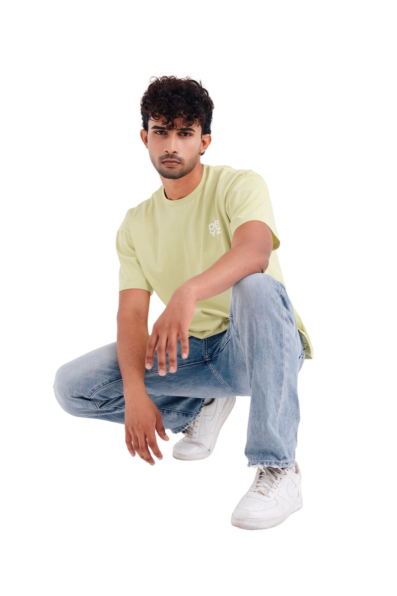 DBYZ Brush Oversized Tee in Pistachio, crouching pose